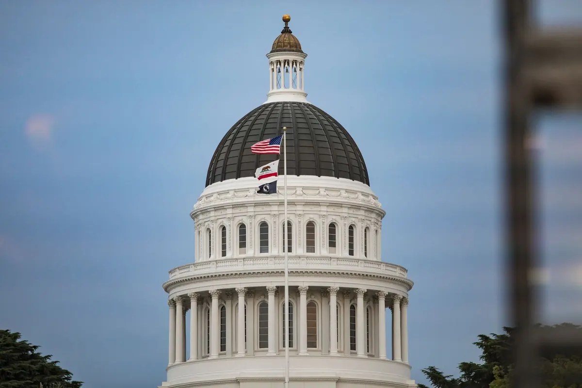 California State Capitol dome with the U.S. and California flags