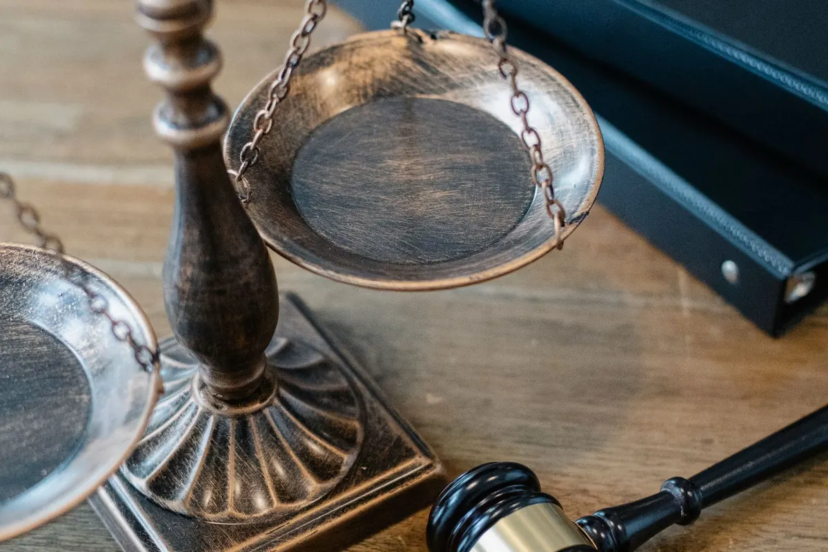 Scales of justice and a gavel on a judge's desk
